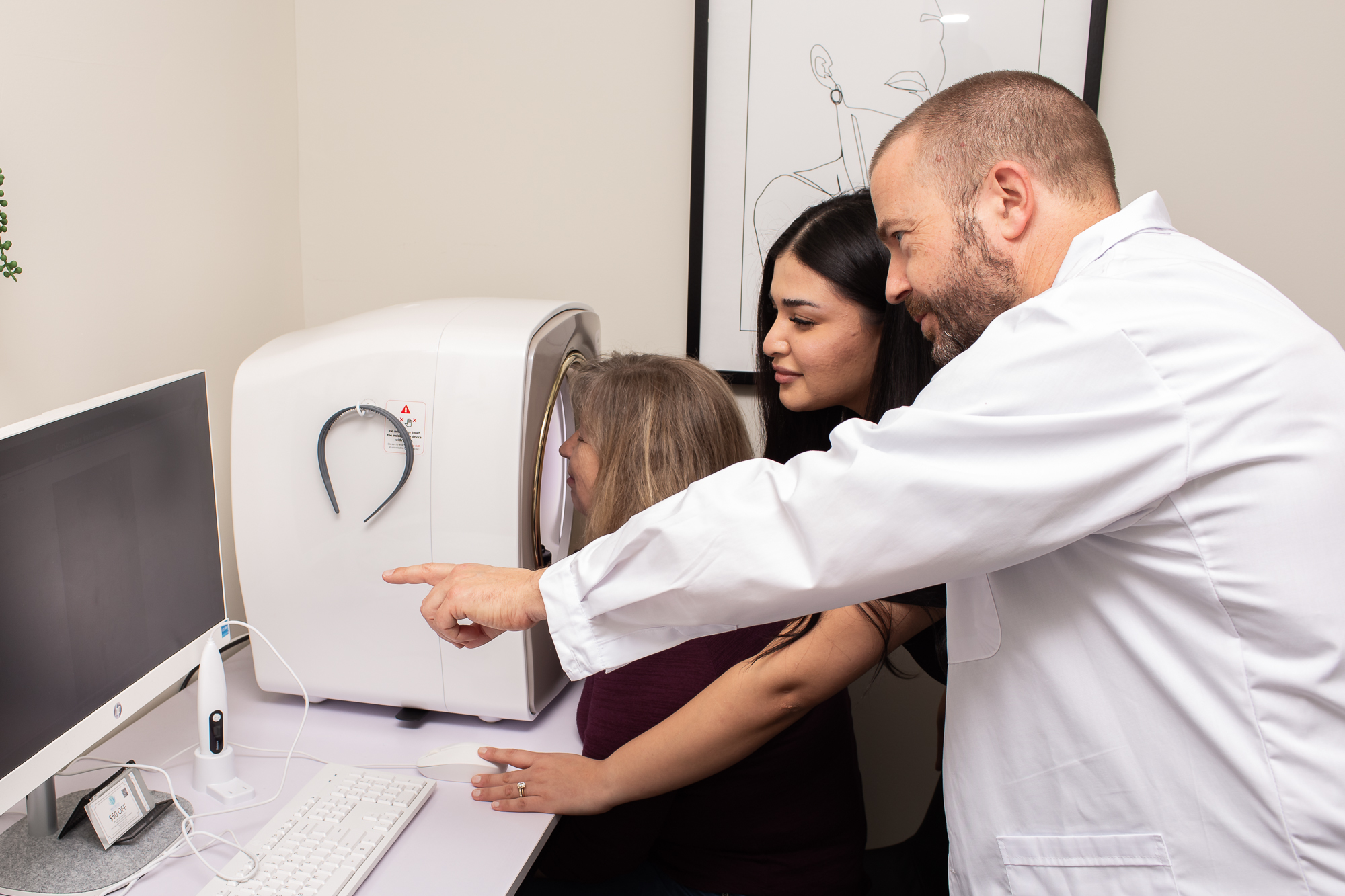 Waterloo Medical Cosmetics team discussing skin imaging during a consultation